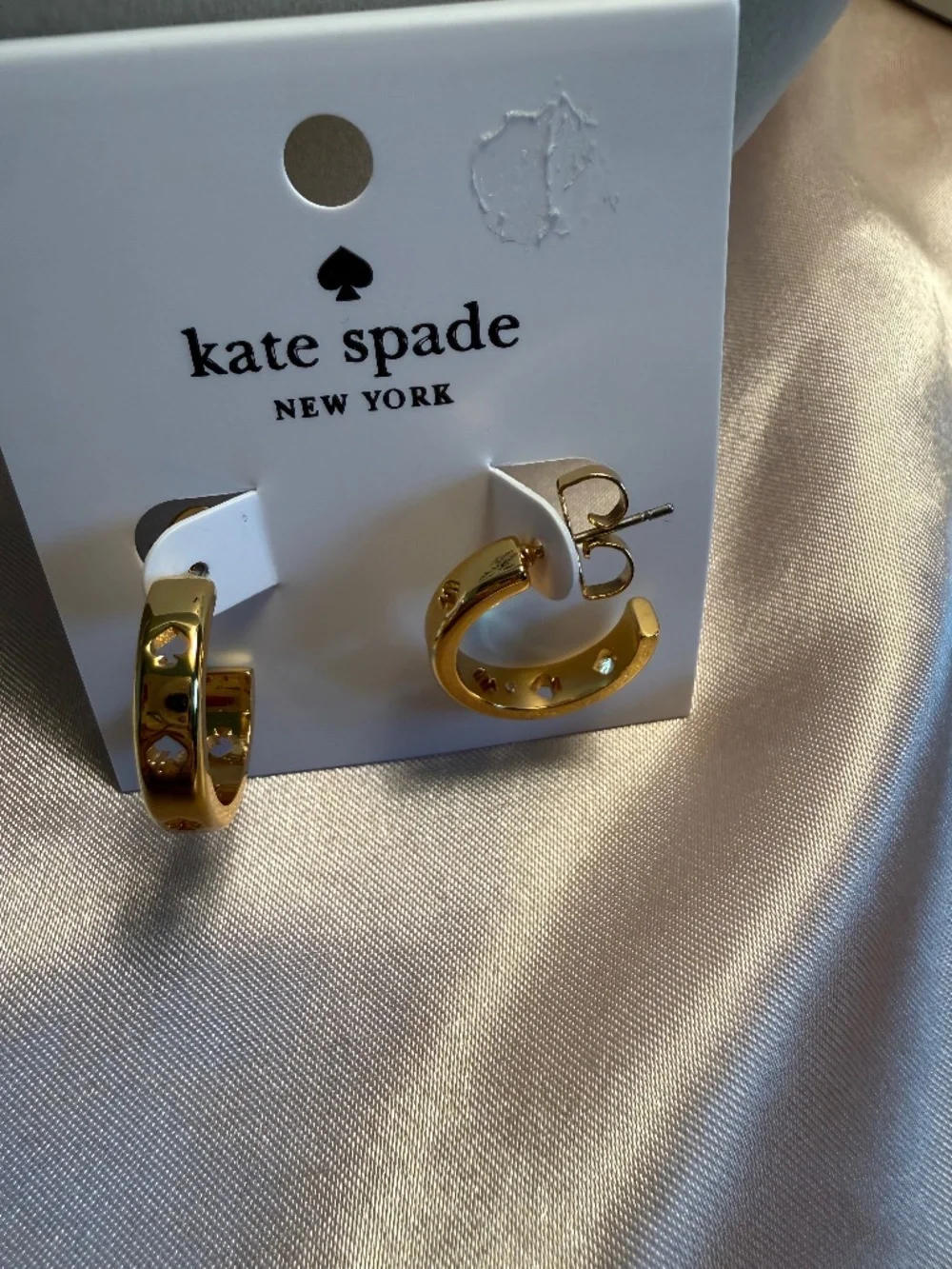 Kate Spade cut out hoop earrings in gold